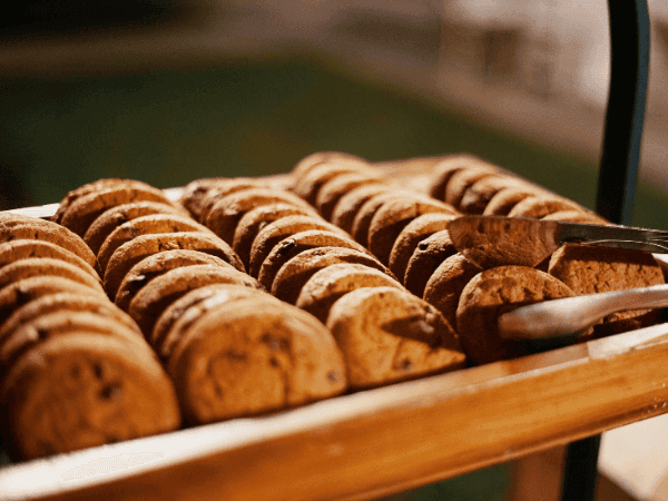 A rustic wooden tray displaying delicious cookies, an inspiration for starting a cottage food business in Maryland